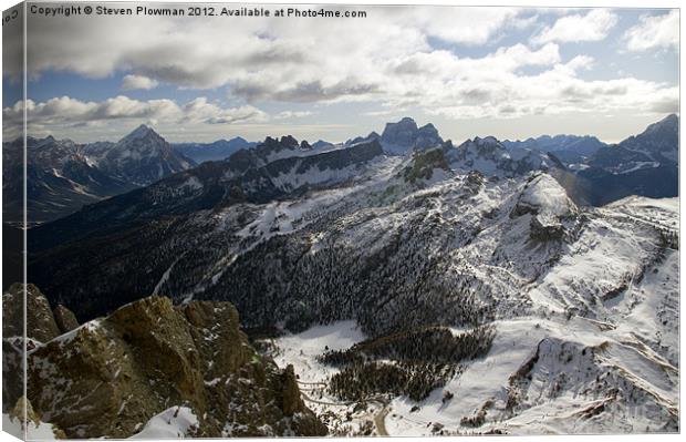 Mountain peaks and cloudy skies Canvas Print by Steven Plowman