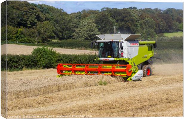 A Cllaas lexion 570 Combine Harvester  Canvas Print by Michael Harper