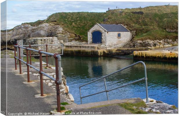 The stone boathouse and slipway at Ballintoy Harbo Canvas Print by Michael Harper
