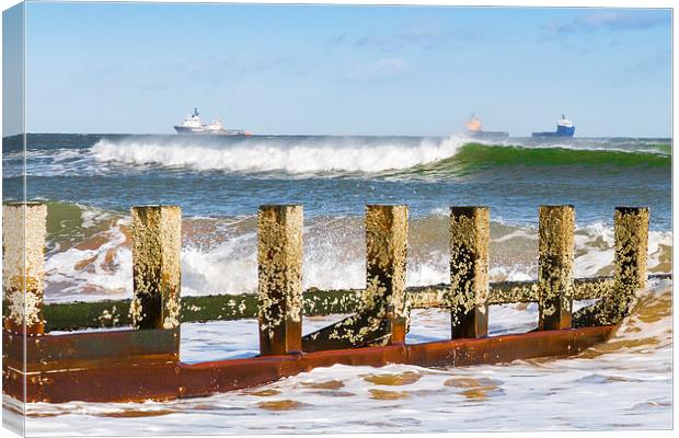 Against The Waves Canvas Print by Bill Buchan