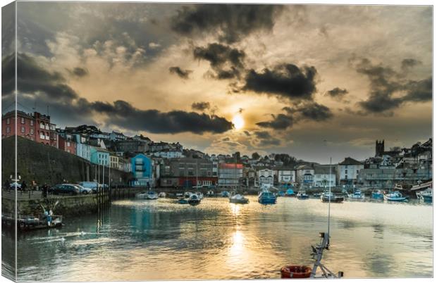 Brixham Harbour with a Setting Sun Canvas Print by Gordon Dimmer