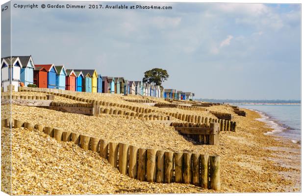 Colourful Beach Huts at Calshot Canvas Print by Gordon Dimmer