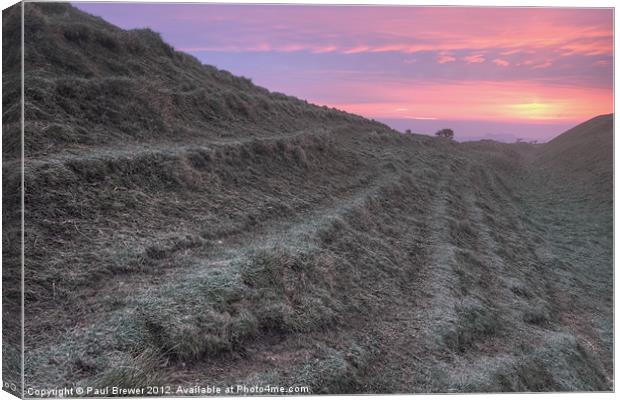 Maiden Castle Ramparts at Sunrise Canvas Print by Paul Brewer