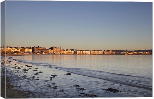 Sunrise over Weymouth in March Canvas Print by Paul Brewer