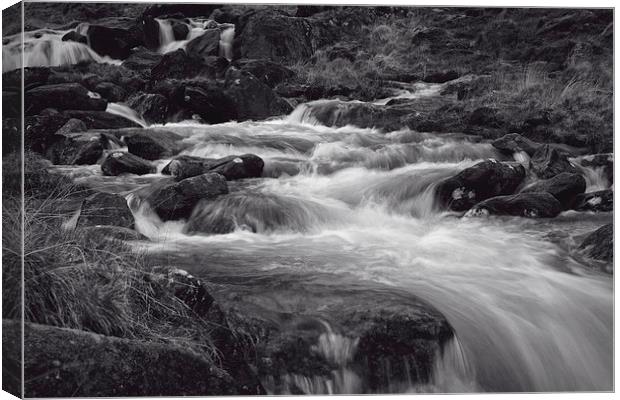 Flowing River at Pen-y-Gwryd in Snowdonia National Canvas Print by Paul Brewer