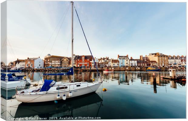 Weymouth Harbour at sunset Canvas Print by Paul Brewer