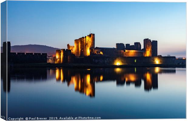Caerphilly Castle at night in winter Canvas Print by Paul Brewer