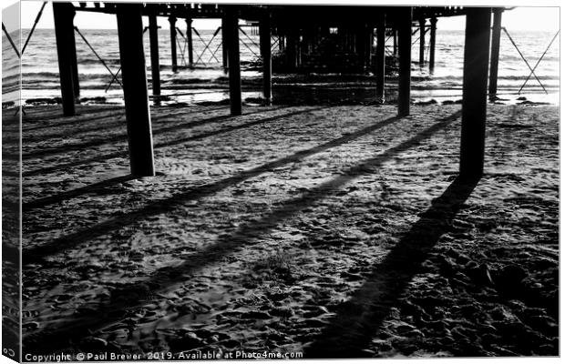 Under the Pier Canvas Print by Paul Brewer