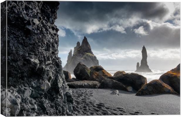 Reynisdrangar sea stacks at Reynisfjara black beac Canvas Print by Greg Marshall