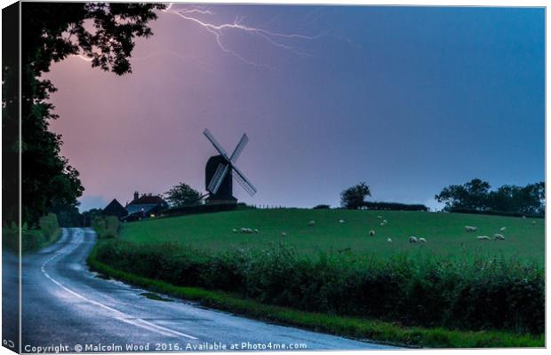 Lightning Over Windmill Canvas Print by Malcolm Wood