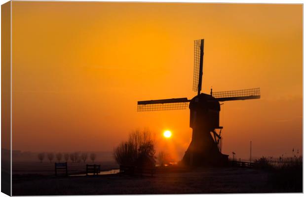 Warm sunrise on the Kinderdijk windmill in Rotterd Canvas Print by Ankor Light