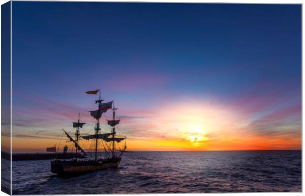 Silhouette of a pirate ship leaving the harbor Canvas Print by Ankor Light