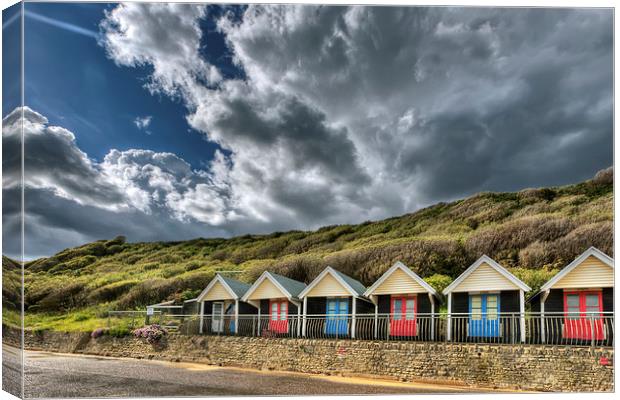 Clouds, beach huts and light Canvas Print by Jennie Franklin
