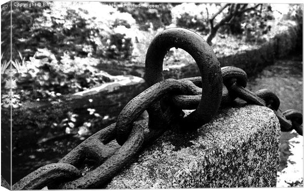  Rusty Chain By The Mill Stream. Canvas Print by Brian Sharland