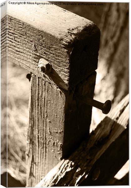 Metal bolts on timber posts Canvas Print by Alfani Photography