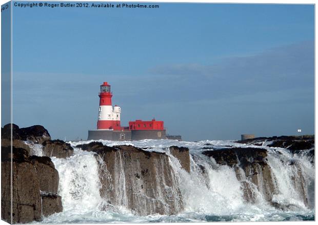 Waves Break at Longstone Lighthouse Canvas Print by Roger Butler