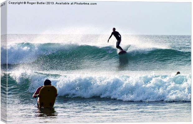 Wave Riders Canvas Print by Roger Butler