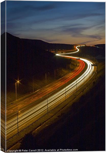 Motorway Light Trails Canvas Print by Peter Carroll