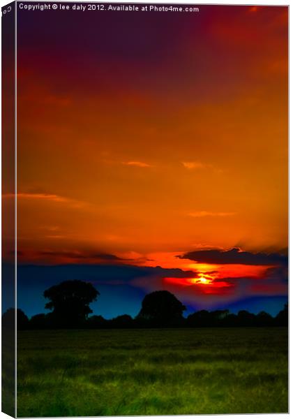 Sun set over Ludham. Canvas Print by Lee Daly