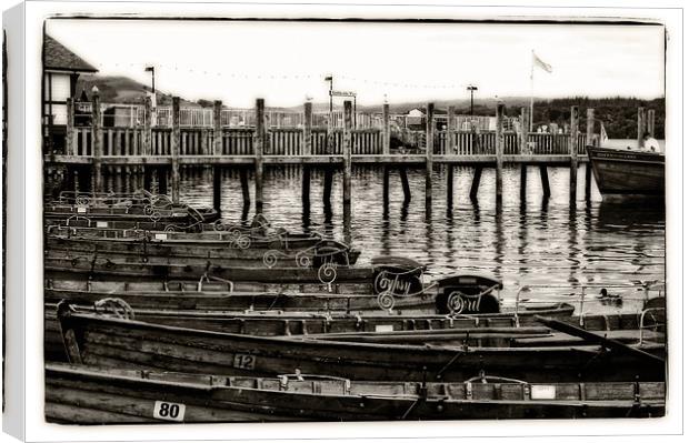 rowing boats on the pier Canvas Print by jane dickie