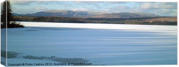 Mountains Over Frozen Lake Canvas Print by Peter Castine