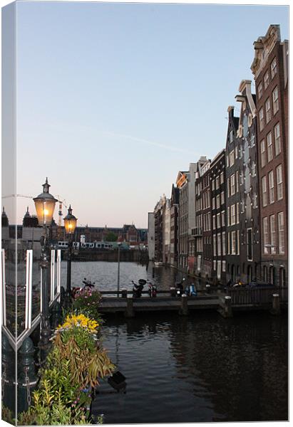 Canal in Amsterdam Canvas Print by Emma Finbow