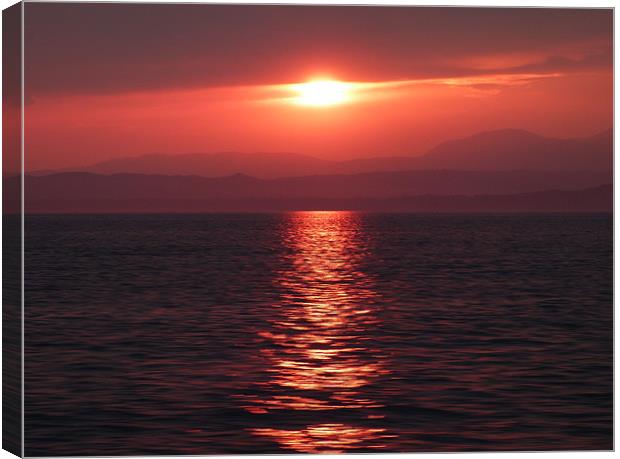 Sunset on lake Garda Canvas Print by Lynn hanlon