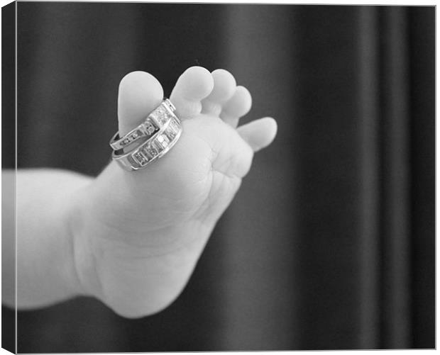 Babies foot with mummies rings Canvas Print by Charlotte Anderson