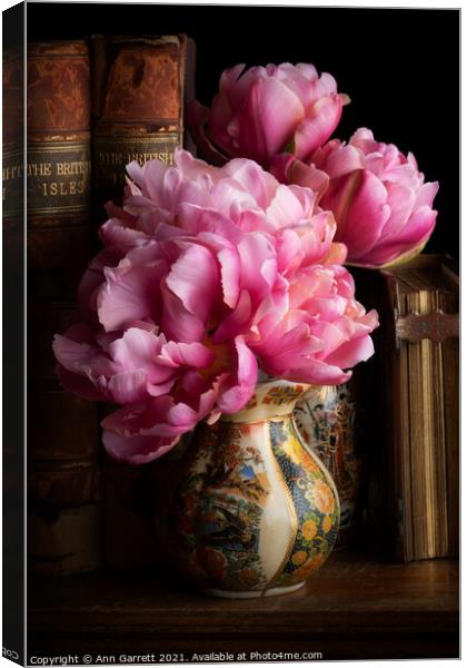 Tulips in the Library Canvas Print by Ann Garrett