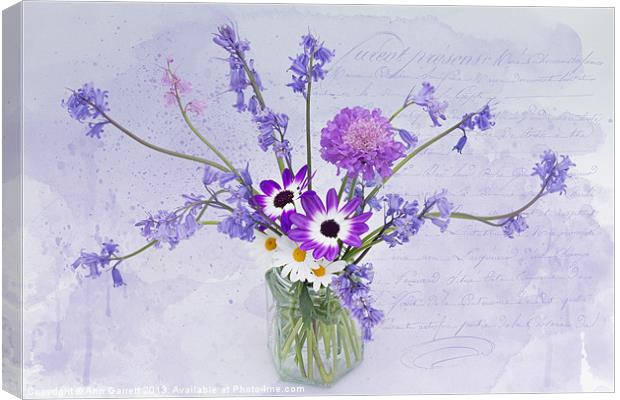 Spring Flowers in a Jam Jar Canvas Print by Ann Garrett
