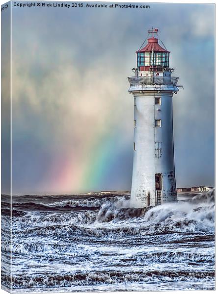  The Lighthouse and Rainbow Canvas Print by Rick Lindley