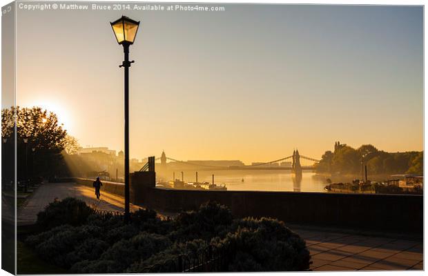  Early morning: Hammersmith Bridge, lone cyclist Canvas Print by Matthew Bruce