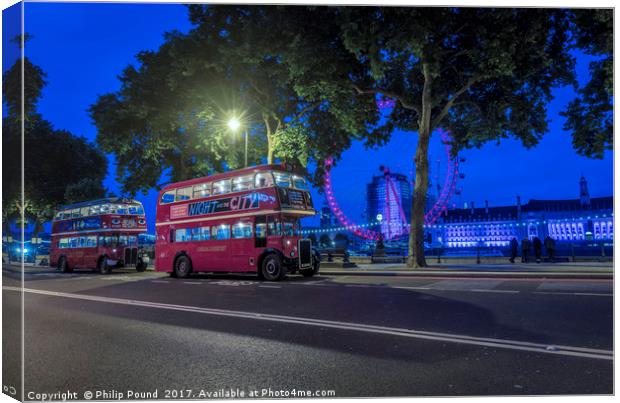 London Red Buses at Night on Victoria Embankment Canvas Print by Philip Pound