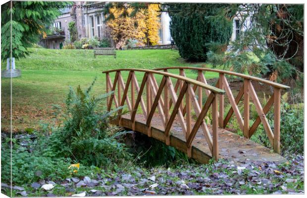 Bridge over Highland stream Canvas Print by Derek Corner