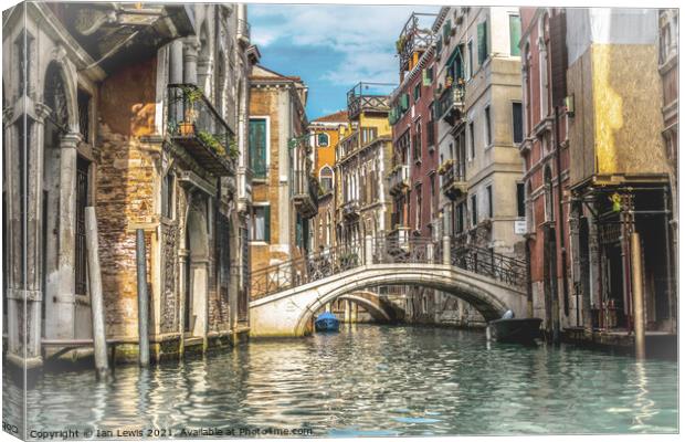 A Beautiful Venetian Canal Canvas Print by Ian Lewis
