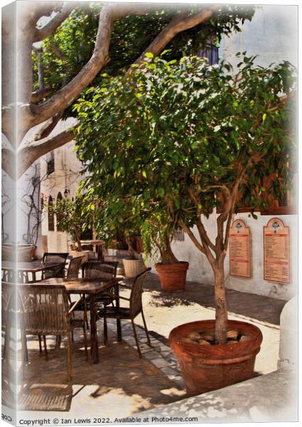 A Shaded Table in Mojácar Canvas Print by Ian Lewis