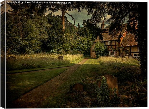 Cottage In The Churchyard Canvas Print by Ian Lewis