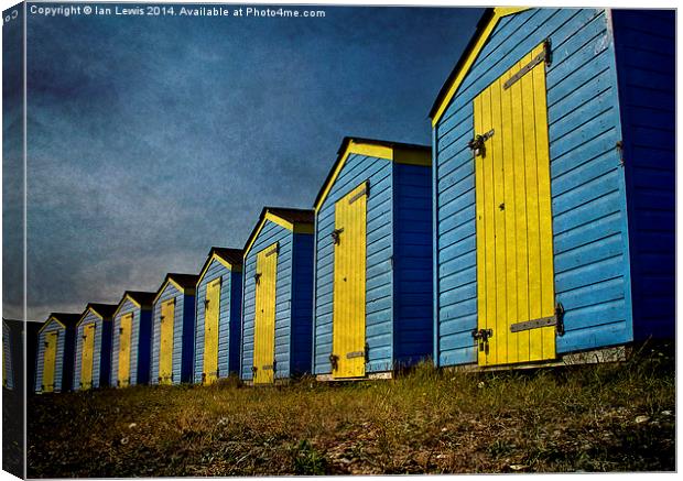  Blue and Yellow Beach Huts Canvas Print by Ian Lewis