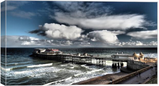 Cromer Pier with sun and clouds Canvas Print by mark humpage