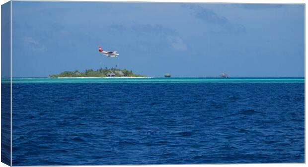 Maldives Islands with sea plane landing Canvas Print by mark humpage