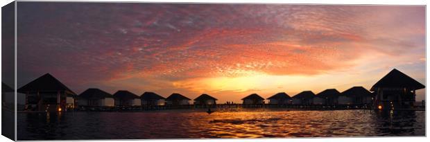 Maldives sunset over water bungelows Canvas Print by mark humpage