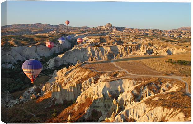Ballooning Over Goreme Valley Canvas Print by Carole-Anne Fooks