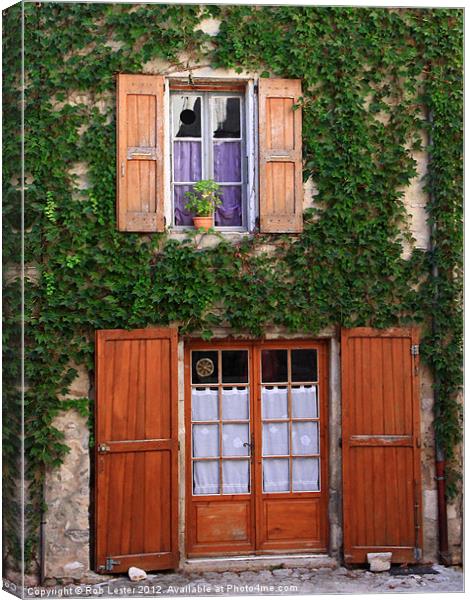 A Cottage in Provence Canvas Print by Rob Lester