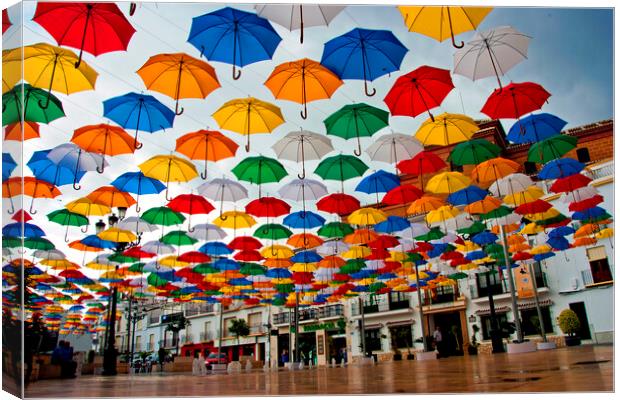 "Vibrant Umbrella Canopy in Torrox" Canvas Print by Andy Evans Photos