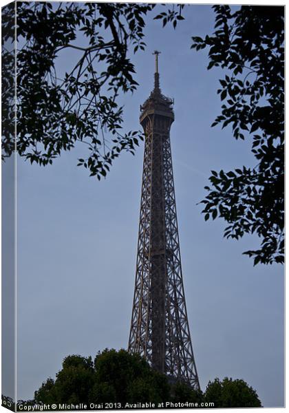Eiffel Tower through the trees Canvas Print by Michelle Orai