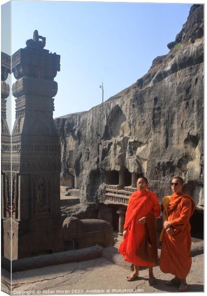 Monks Pose for a Picture at the Ellora Caves Canvas Print by Aidan Moran