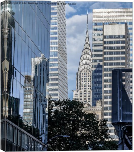 Reflecting on New York's Iconic Chrysler Building Canvas Print by John Hastings
