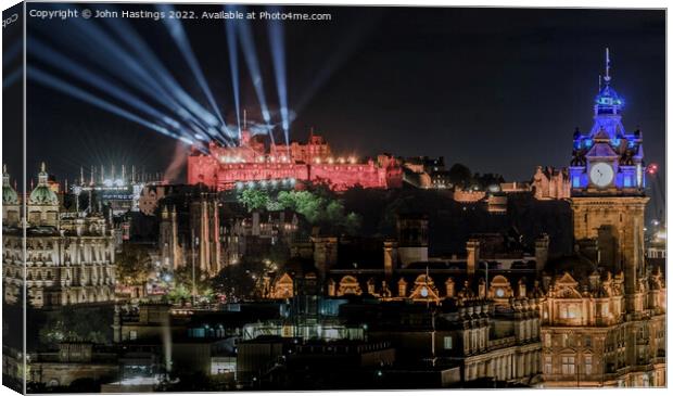 Illuminating Edinburgh's Historic Castle Canvas Print by John Hastings