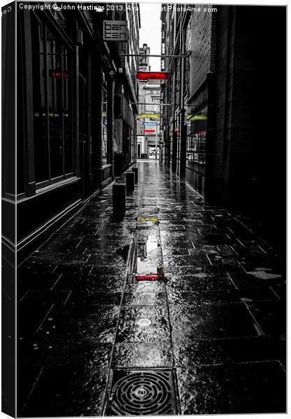 Rainy Lane on Sunday Canvas Print by John Hastings