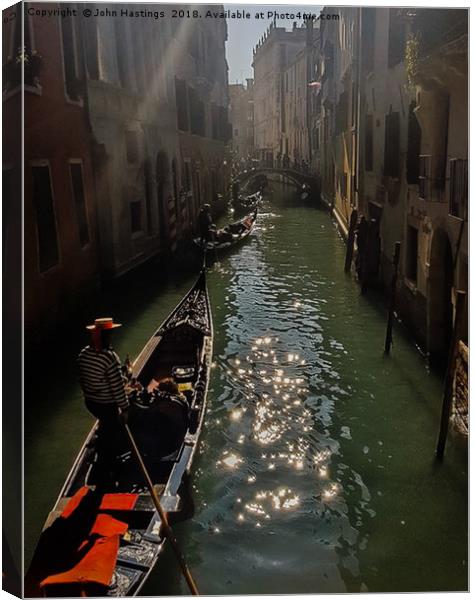 Illuminating Venice Canvas Print by John Hastings